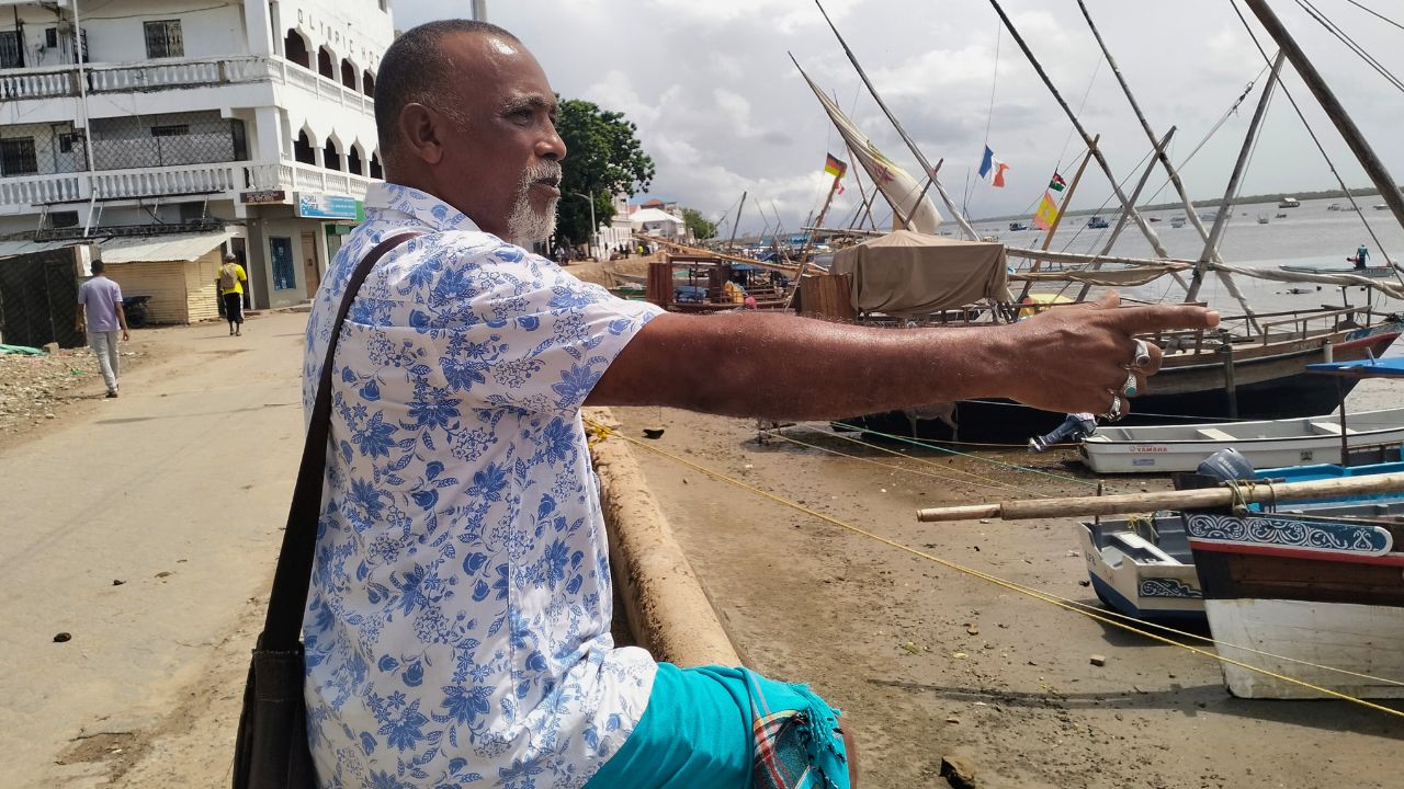 Somo M. Somo pointing out fishing dhows on the seafront